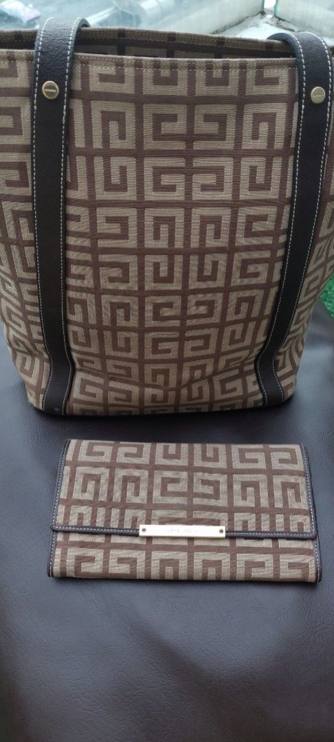 Givenchy Canvas Monogram Tote Bag and Wallet Set (Category: Luxury Bags & Wallets) located in Makati City. Submitted by heinzly (Listing ID 1451896646, Image 3). Description: - Givenchy monogram canvas tote bag and matching wallet - Color: Brown and beige - Tote features leather trim and handles - Zipper closure on the tote bag - Wallet has a gold-tone clasp and interior card slots - Ideal for everyday use BAG AND WALLET SET These bag and wallet 