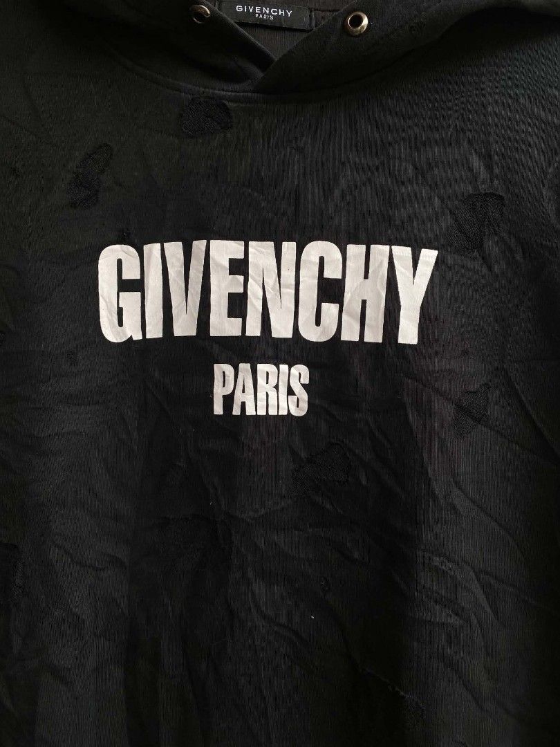Givenchy Paris logo distressed hoodie black (Category: Luxury Apparel) located in Cabuyao City. Submitted by PHdowner30 (Listing ID 1451710111, Image 2). Description: FOR SALE ONLY Givenchy Paris logo distressed hoodie black Size: 2xl ( 22x27 ) Very good condition Issue: missing drawstrings Complete tags P400 + SF negotiable Pm.