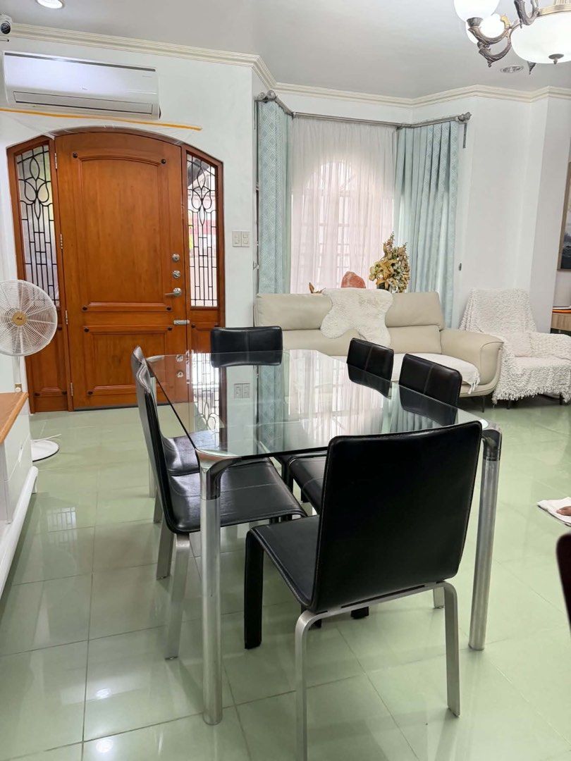 Glass Top Dining Table with 6 Black Chairs (Category: Tables & Sets) located in Binangonan. Submitted by blairmayie (Listing ID 1451761364, Image 3). Description: - Sleek glass top dining table with a sturdy metal frame. - Includes 6 comfortable black faux leather upholstered chairs. - Chairs feature durable metal legs. - Comfortably seats up to 6 people. - Ideal for family dinners and hosting guests. - Ready to upgrade your dining space!.