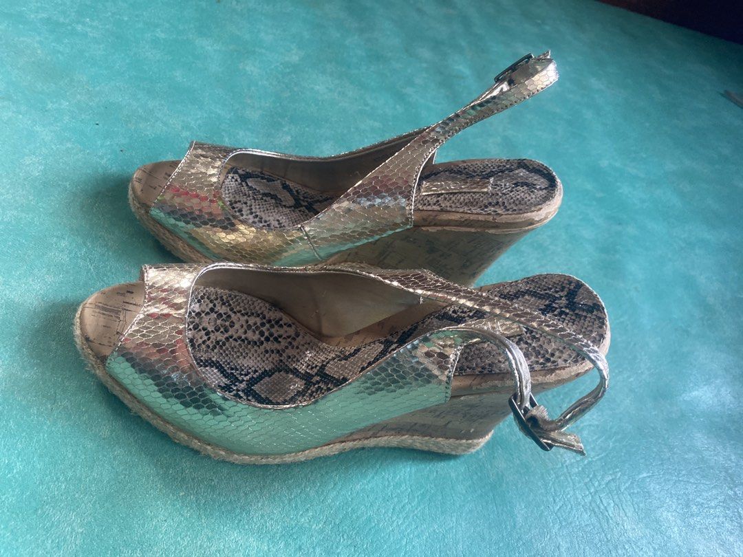 Gold Snake Print Wedge Sandals with Ankle Strap (Category: Wedges) located in Manila. Submitted by narsonlineexpression (Listing ID 1451780393, Image 2). Description: - Stylish gold wedge sandals - Eye-catching snake print footbed - Open toe design for comfort - Secure adjustable ankle strap - Trendy espadrille rope detail around the sole - Perfect for dressing up or down.