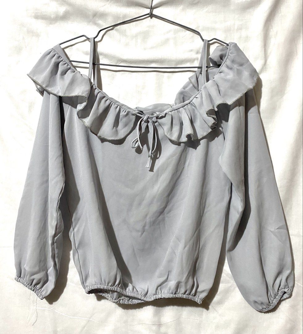 Grey Off-Shoulder Ruffle Tie-Front Long Sleeve Top (Category: Blouses) located in Baguio. Submitted by royalriver17 (Listing ID 1451864763, Image 1). Description: Cute grey off-shoulder top with ruffles, long sleeves, and a tie-front. Elasticated hem and cuffs for comfort. Lightweight and versatile!.