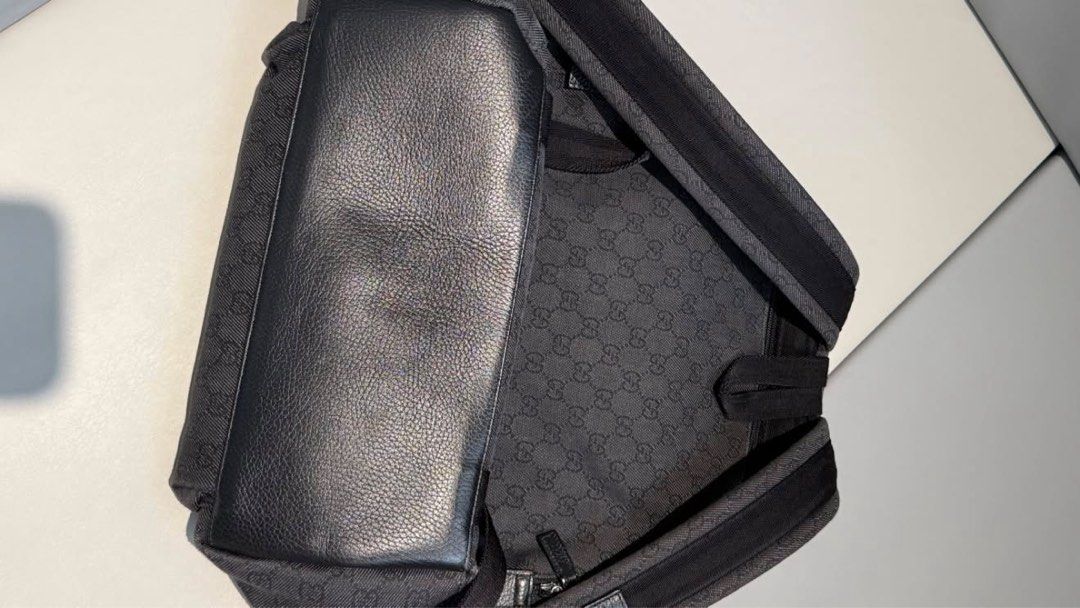 Gucci GG Monogram Canvas Backpack (Category: Luxury Bags & Wallets) located in Rizal. Submitted by ms.shade (Listing ID 1451775037, Image 3). Description: - Authentic Gucci backpack - Classic GG monogram pattern - Durable canvas with leather trim - Front zip pocket - Main compartment - Drawstring closure with buckle flap - Includes original dust bag - Ideal for everyday use or travel.