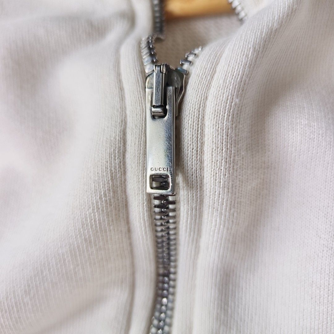 Gucci Half-Zip Hoodie (Category: Luxury Apparel) located in Banaue. Submitted by radical.thrift (Listing ID 1451717946, Image 3). Description: Gucci Halfzip Hoodie •it features the brand's iconic green & red stripe details with a vintage logo label •best fit to adult sizes small-medium men's or large women's (20W 26.5L) •good as new condition •authentic ₱2500 only.