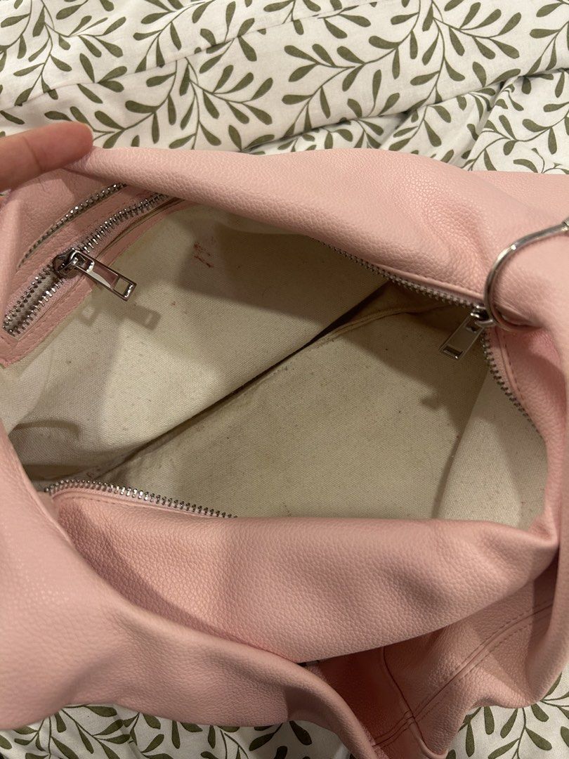 GVN Medium Hobo Bag in Blush (Light Pebbled Leather) (Category: Shoulder Bags) located in Marikina City. Submitted by decluttering522 (Listing ID 1451748646, Image 2). Description: - GVN medium hobo bag - Blush pink color - Light pebbled leather - Zipper closure - Interior has some marks (please check photos) - Comfortable shoulder strap - Stylish everyday bag.