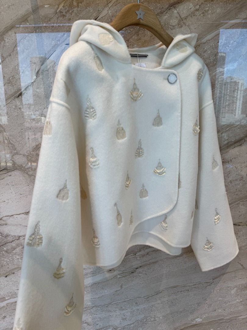 Hermes White Embroidered Hooded Jacket (Category: Coats, Jackets and Outerwear) located in Pateros City. Submitted by braveflower.abe09d (Listing ID 1451755293, Image 3). Description: - Unique white hooded jacket - All-over embroidered tassel details - Asymmetrical one-button closure - Appears to be a wool blend - Ideal for cooler weather - Check photos for detailed views.