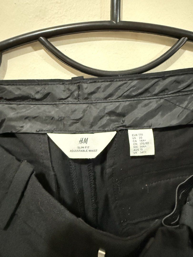 H&M Black Trouser/Slacks (Category: Babies & Kids Fashion) located in Taguig. Submitted by _decluttermomma_ (Listing ID 1451882994, Image 2). Description: Preloved H&M Slim fit Trouser/Slacks Pockets on both side Rear pockets are design only Adjustable waist Size posted on photo (9-11 years old) Used once 💵 250.
