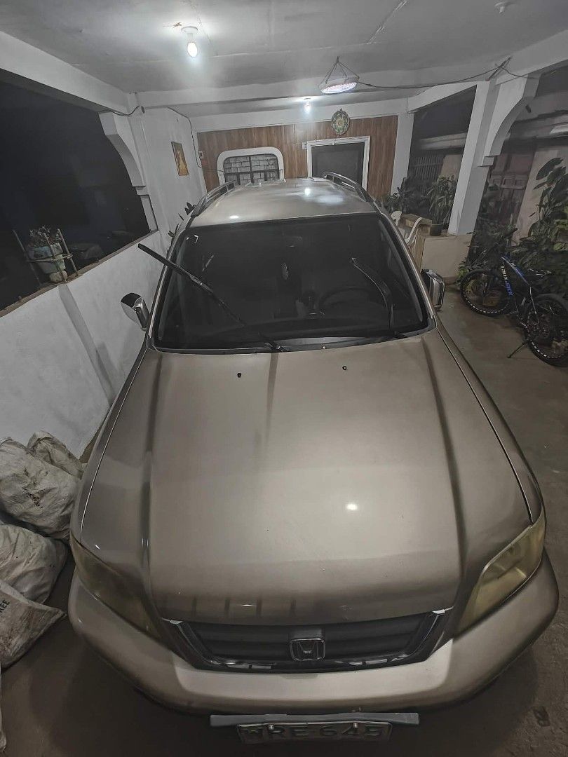 Honda CR-V 2.0 (A) (Category: Used Cars) located in Santa Cruz. Submitted by .rx-78-2 (Listing ID 1451705617, Image 3). Description: Issues: passenger seatbelt not working deep scratches and stains on paint and rims no roof rail cover repaired side mirror (driver side) automatic windows not working properly rear wiper not working registration expired May 2026 Repairs done: Transmission rebuild Sep 2021 Transmission support replaced Sep 2021 Engin