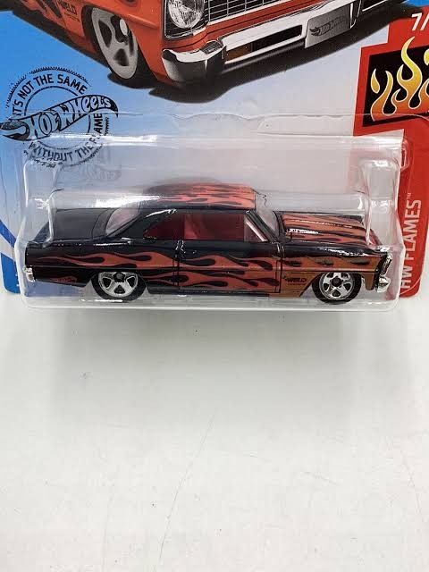 Hot Wheels 1969 Nova SS Black Flames Diecast Car (Category: Vehicle & Diecast Models) located in Quezon City. Submitted by caseybrian47891 (Listing ID 1451736734, Image 2). Description: Hot Wheels 1966 Chevy Nova Black e Flaming Decals - Bnew mint carded - Features: Chrome grille and wheels, red interior -Hard to find Hotwheels item - Condition: Great detail, perfect for any collection -Can send thru lbc or lalamove .