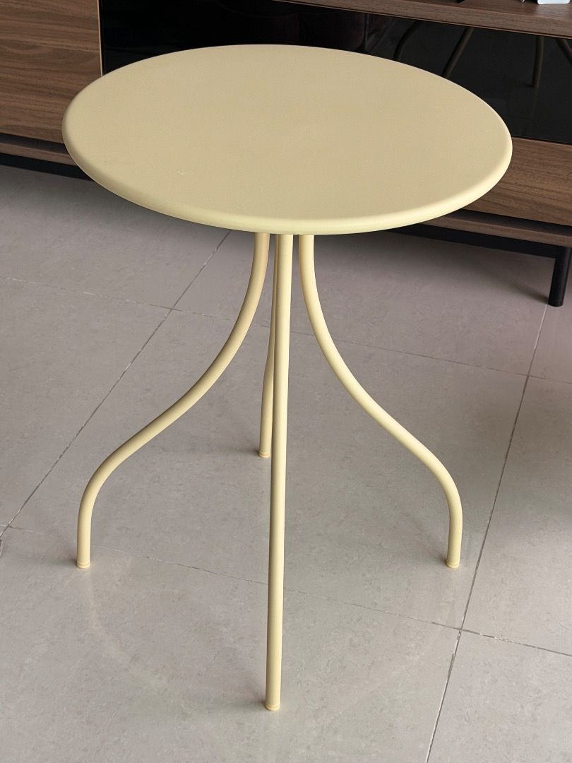 IKEA Round Side Table with Curved Legs - Cream/Yellow (Category: Tables & Sets) located in Angeles City. Submitted by lizdesantiago (Listing ID 1451897484, Image 2). Description: - Cute round side table - Creamy yellow color - Modern design with three curved legs - Perfect for small spaces or as an accent piece - Great for holding drinks or small plants - Lightweight and easy to move.