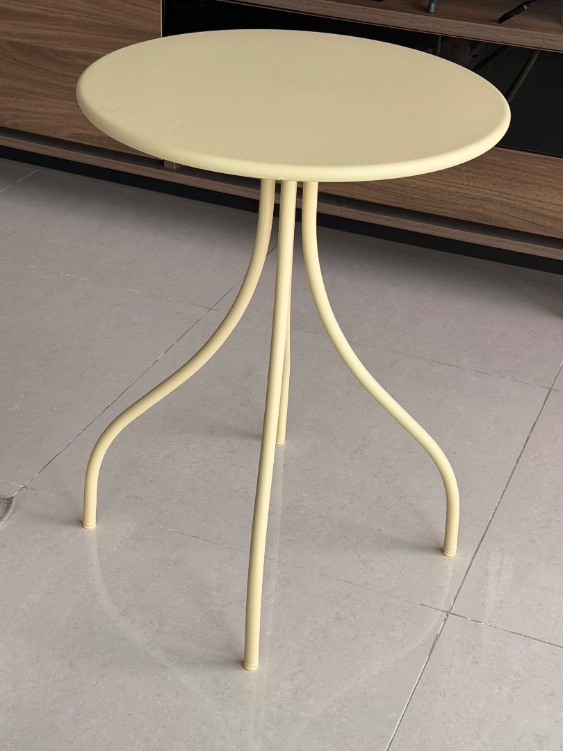IKEA Round Side Table with Curved Legs - Cream/Yellow (Category: Tables & Sets) located in Angeles City. Submitted by lizdesantiago (Listing ID 1451897484, Image 3). Description: - Cute round side table - Creamy yellow color - Modern design with three curved legs - Perfect for small spaces or as an accent piece - Great for holding drinks or small plants - Lightweight and easy to move.