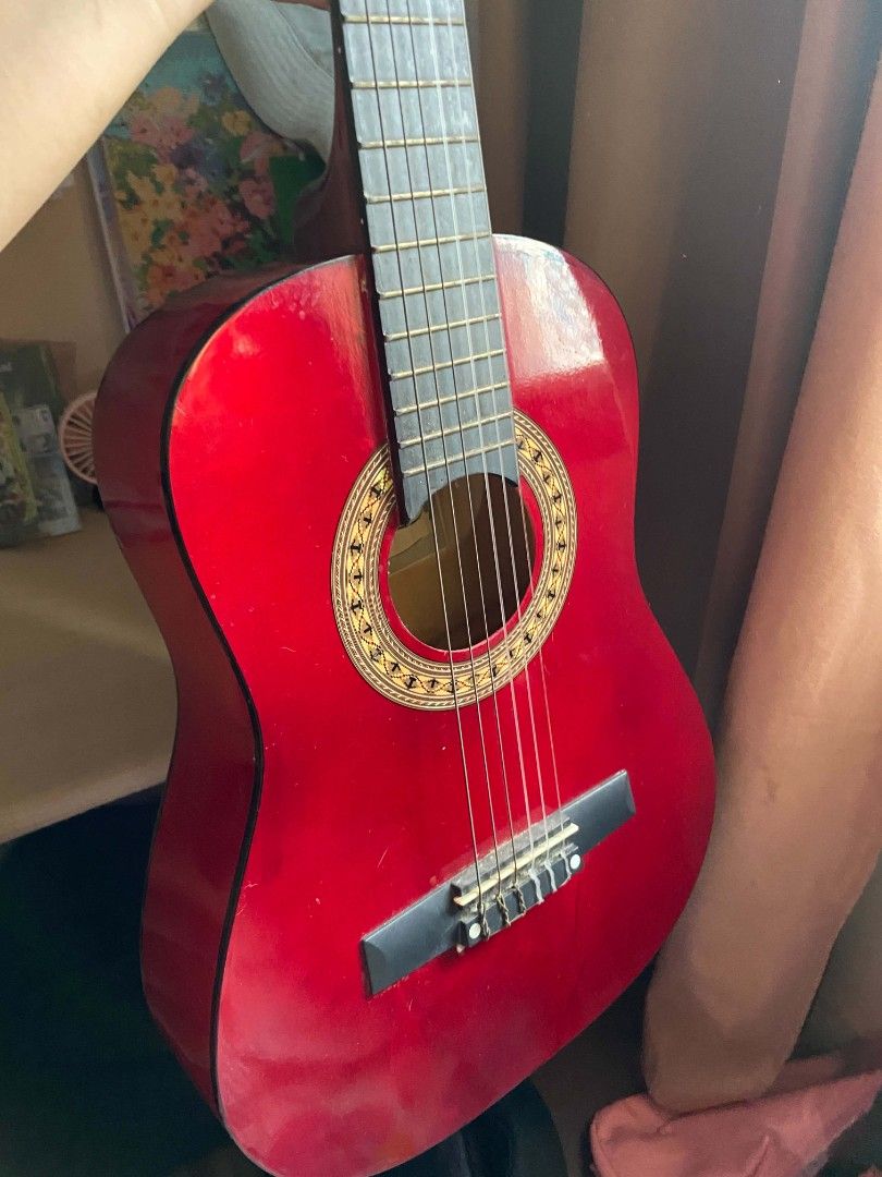 Jasmine Red Classical Guitar (Category: Musical Instruments) located in Cavite. Submitted by 4leafcolover (Listing ID 1451808904, Image 1). Description: Selling my beautiful red Jasmine classical guitar with guitar stand, bag, and picks - Good for beginners - Nylon strings - lady owned - rfs: need funds for medical bills - mod: lalamove or moveit (shouldered by buyer) - mop: maribank (qr payment) .