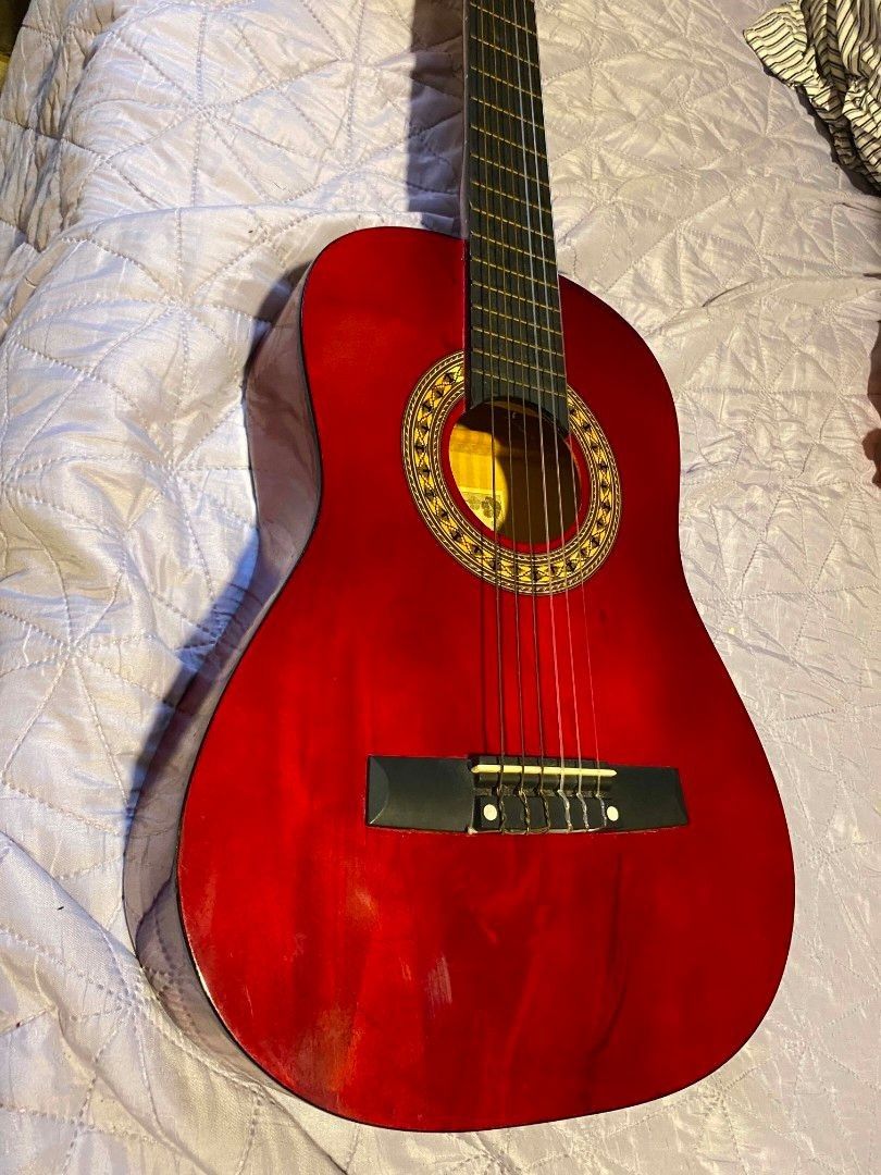 Jasmine Red Classical Guitar (Category: Musical Instruments) located in Cavite. Submitted by 4leafcolover (Listing ID 1451808904, Image 2). Description: Selling my beautiful red Jasmine classical guitar with guitar stand, bag, and picks - Good for beginners - Nylon strings - lady owned - rfs: need funds for medical bills - mod: lalamove or moveit (shouldered by buyer) - mop: maribank (qr payment) .