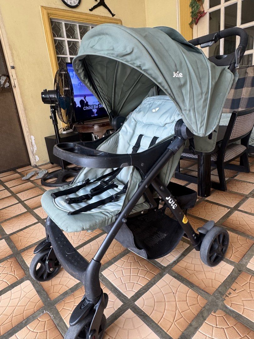 Joie Stroller - Sage Green (Category: Strollers) located in Makati City. Submitted by prille (Listing ID 1451782455, Image 3). Description: - Joie stroller in stylish sage green - Secure 5-point safety harness - Large canopy for sun protection - Convenient front tray for snacks/drinks - Spacious storage basket underneath - Compact fold for easy transport - Ready for your baby's adventures!.