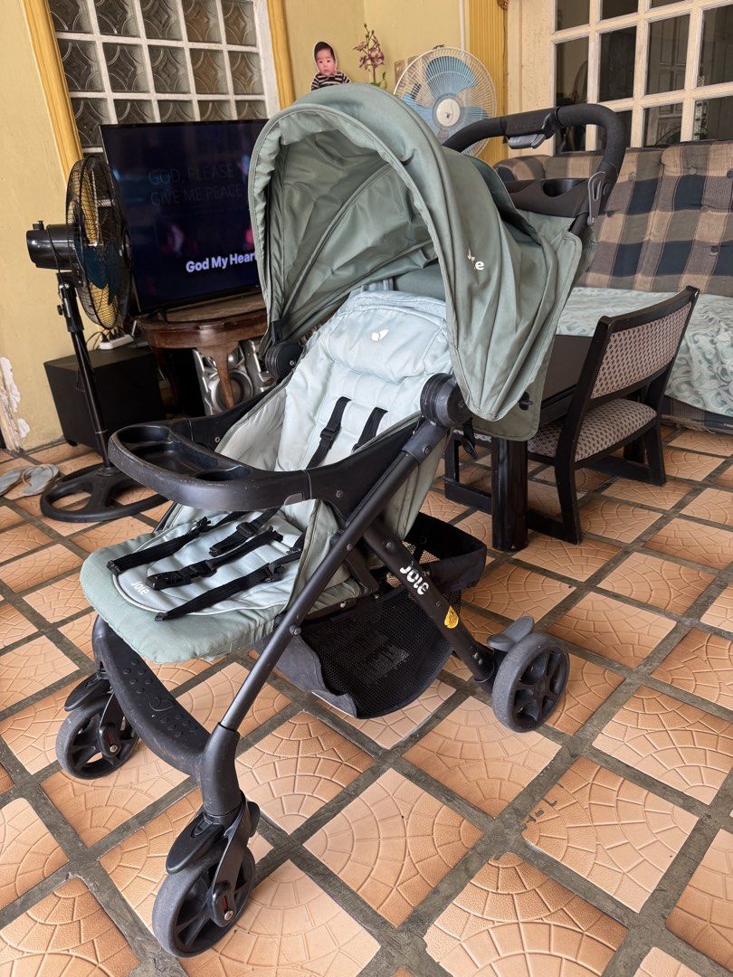 Joie Stroller - Sage Green (Category: Strollers) located in Makati City. Submitted by prille (Listing ID 1451782455, Image 2). Description: - Joie stroller in stylish sage green - Secure 5-point safety harness - Large canopy for sun protection - Convenient front tray for snacks/drinks - Spacious storage basket underneath - Compact fold for easy transport - Ready for your baby's adventures!.