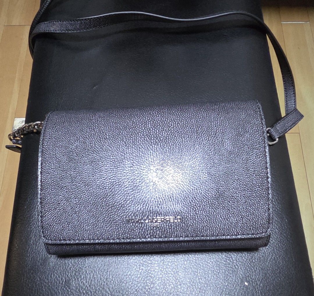 Karl Lagerfeld Paris Wallet (Category: Luxury Bags & Wallets) located in Manila. Submitted by daddyhunt99 (Listing ID 1451779218, Image 1). Description: Black textured leather wallet on chain from Karl Lagerfeld Paris. Magnetic snap closure. Inside has card slots and a zippered compartment. Chain and leather strap. Great for essentials..