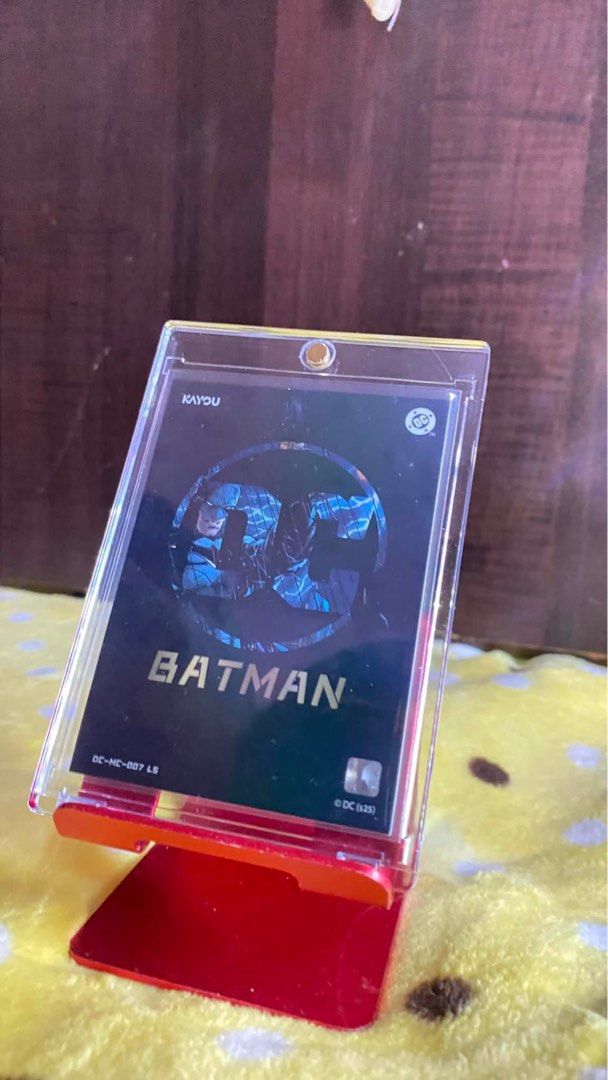KAYOU Batman Trading Card Bruce Wayne DC Comics (Category: Raw Singles) located in Manila. Submitted by vince1619 (Listing ID 1451842309, Image 2). Description: - KAYOU Batman Trading Card - Features Bruce Wayne - Official DC Comics collectible - Comes in a protective sleeve and stand - Ideal for Batman fans and collectors.