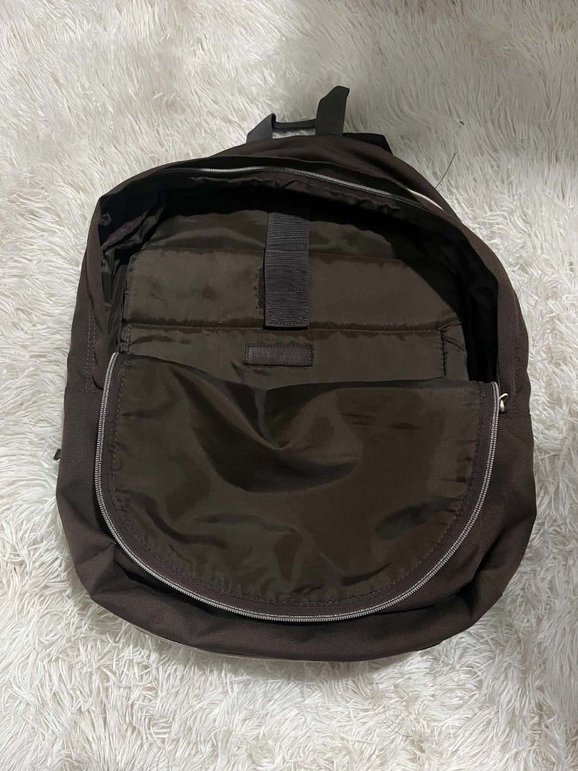 Lacoste Brown Polyester Backpack (Category: Backpacks) located in Manila. Submitted by senggggg. (Listing ID 1451835320, Image 3). Description: good condition working zip check details issue and size.