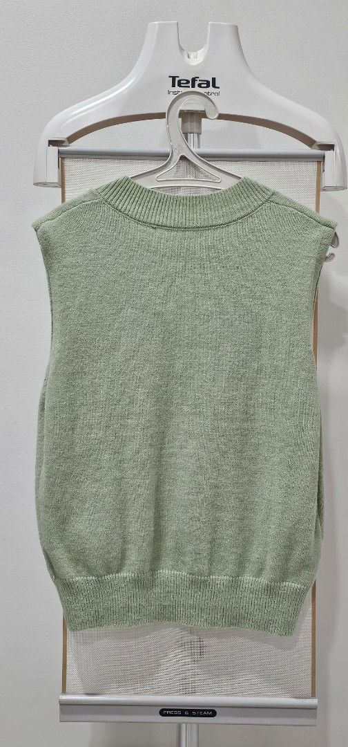 Light Green V-Neck Knit Sweater Vest (Category: Sleeveless) located in Caloocan City. Submitted by jho0618 (Listing ID 1451781364, Image 2). Description: - Light green knit sweater vest - V-neck design with ribbed trim - Sleeveless style - Ideal for layering over shirts or dresses - Made of soft material Please message me for measurements .