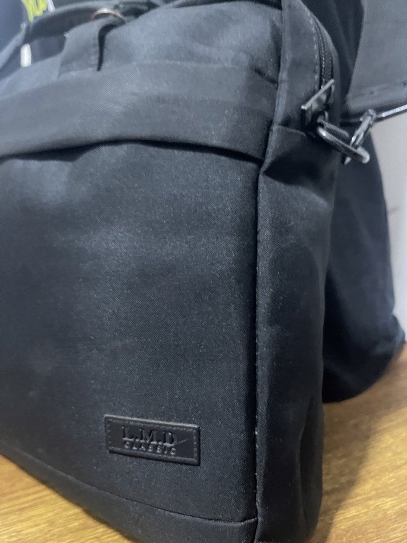 LMD Classic Black Laptop Bag Messenger Bag (Category: Laptop Bags & Sleeves) located in Kuala Lumpur. Submitted by pickers2000 (Listing ID 1451887088, Image 1). Description: - Classic black laptop bag - Main compartment for storage - Front zipper pocket - Additional smaller front zip pocket - Detachable shoulder strap included - Ideal for carrying laptops and daily essentials - Simple and functional design.