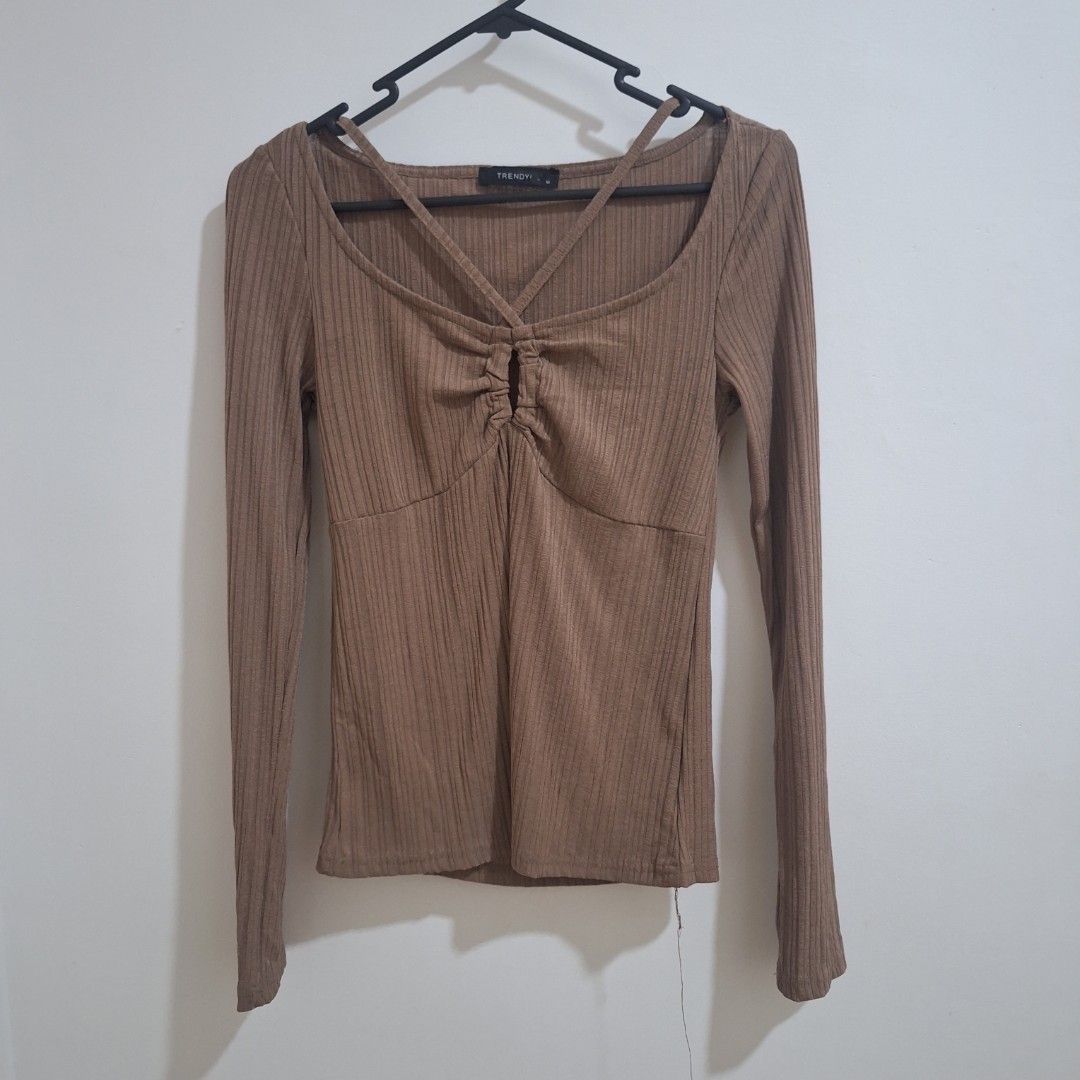 TRENDY Long Sleeved Ribbed Top Boho Style (Brown) (Category: Longsleeves) located in Quezon City. Submitted by nicsukay (Listing ID 1451704738, Image 2). Description: ♡ ribbed material, good quality! ♡ bought it in surplus ♡ criscross neckline, fitted style ♡ fits S-M rfs: decluttering.