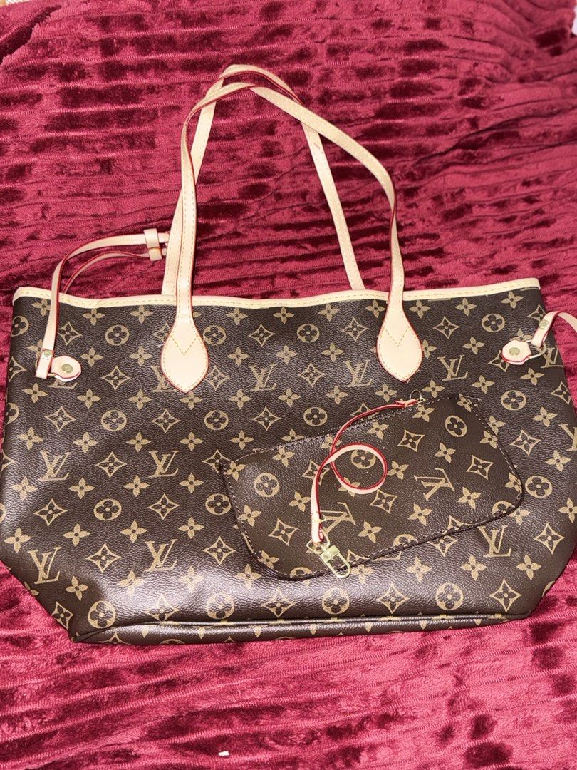 Louis Vuitton Monogram Tote Bag with Pouch (Category: Luxury Bags & Wallets) located in Santa Rosa. Submitted by lynjaneee (Listing ID 1451867873, Image 2). Description: - Classic Louis Vuitton Monogram tote bag - Features a stylish red striped interior - Includes a convenient zippered pocket inside - Comes with a matching monogram pouch - Ideal for everyday use or travel - Spacious and chic design.