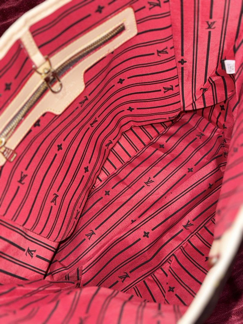 Louis Vuitton Monogram Tote Bag with Pouch (Category: Luxury Bags & Wallets) located in Santa Rosa. Submitted by lynjaneee (Listing ID 1451867873, Image 3). Description: - Classic Louis Vuitton Monogram tote bag - Features a stylish red striped interior - Includes a convenient zippered pocket inside - Comes with a matching monogram pouch - Ideal for everyday use or travel - Spacious and chic design.