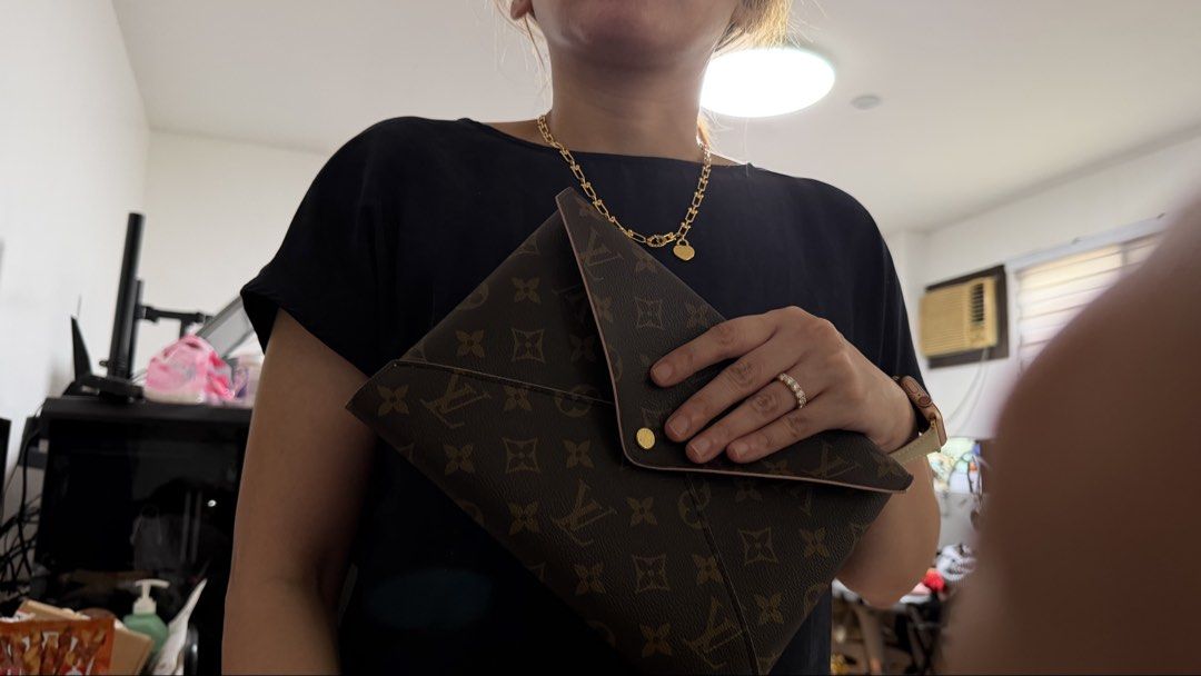 Louis Vuitton Pochette Kirigami w/ Entrupy (Category: Luxury Bags & Wallets) located in Las Pinas. Submitted by atty_katrina (Listing ID 1449925804, Image 3). Description: - Classic Louis Vuitton monogram pouch - Chic pink trim detail - Versatile envelope style with secure snap closure - Ideal for organizing essentials or as a stylish clutch -HD videos available. Pls pm your chosen messaging platform account name /number or email so i can send. .