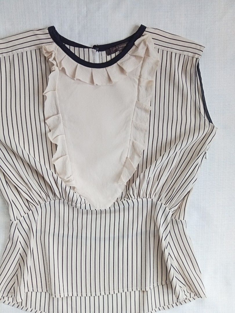 Louis Vuitton sleeveless stripe blouse (Category: Luxury Apparel) located in Bagabag. Submitted by thrift_stories96 (Listing ID 1451844284, Image 2). Description: Louis Vuitton sleeveless stripe blouse Size 40 - medium to large frame Length - 22 Width - 18.5 Condition - excellent Cloth material - silk rayon No flaw.