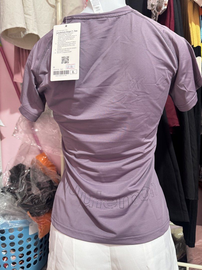 Lululemon Align Short Sleeve Top Purple Size 6 (Category: Activewear) located in San Miguel. Submitted by meseszy (Listing ID 1451699450, Image 3). Description: - Lightweight Lululemon short sleeve top - Pretty purple shade - Subtle striped texture - Breathable perforated details on sleeves - Lululemon logo cut-out on the back - Brand new with tag still attached - Ideal for workouts or casual wear.