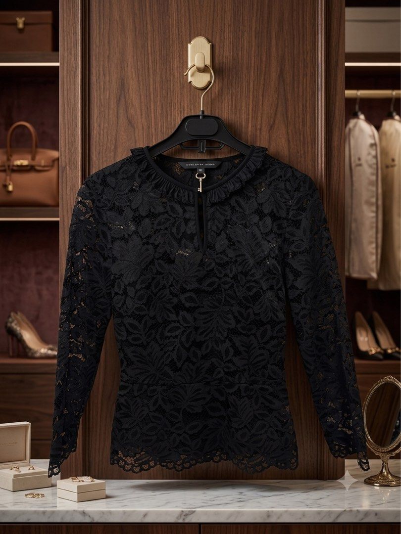Marc by Marc Jacobs Black Lace Top (Category: Sleeveless) located in Muntinlupa City. Submitted by brandsdeclutter (Listing ID 1451834196, Image 2). Description: - Brand: Marc by Marc Jacobs - Color: Black - Material: Lace - Sleeves: Long sleeves - Neckline: Keyhole - Closure: Front zipper with key charm - Design: Beautiful floral lace pattern throughout - Styling: Pairs well with trousers or skirts.