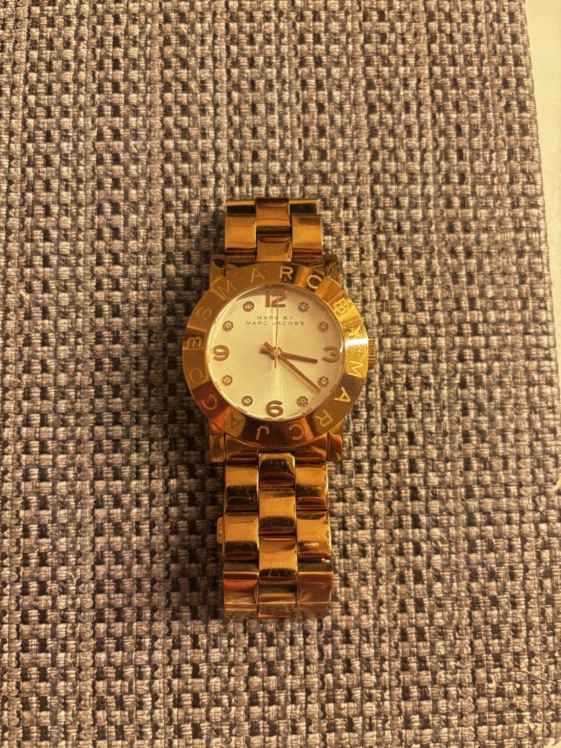 Marc by Marc Jacobs Gold Watch Womens (Category: Women's Watches) located in Pasay City. Submitted by jolline_zy (Listing ID 1451804066, Image 1). Description: - Brand: Marc by Marc Jacobs - Color: Gold - Face: White with gold hour markers and hands - Band: Gold, link style - Bezel: Engraved with brand name - Lightly used - Original - Womens.