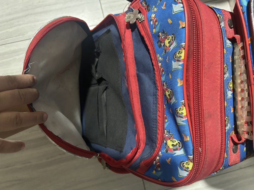 Mickey Mouse Kids' Rolling Bag & Lunch bag (Category: Diaper Bags & Wetbags) located in Paranaque City. Submitted by allthatclutterph (Listing ID 1451821252, Image 2). Description: - Adorable rolling bag for kids - Easy to transport with retractable handle and wheels - Multiple compartments for organized school supplies - Shows some signs of wear, but fully functional, all zippers working properly - Ideal for school or travel adventures - Needs w
