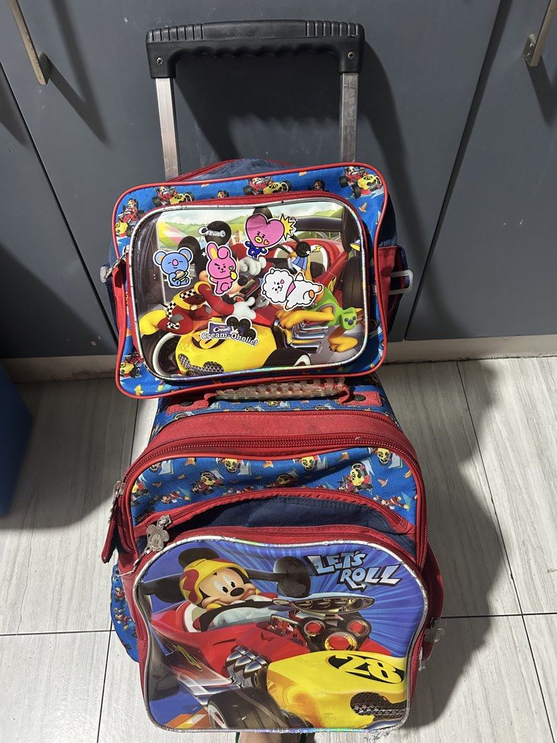 Mickey Mouse Kids' Rolling Bag & Lunch bag (Category: Diaper Bags & Wetbags) located in Paranaque City. Submitted by allthatclutterph (Listing ID 1451821252, Image 1). Description: - Adorable rolling bag for kids - Easy to transport with retractable handle and wheels - Multiple compartments for organized school supplies - Shows some signs of wear, but fully functional, all zippers working properly - Ideal for school or travel adventures - Needs w