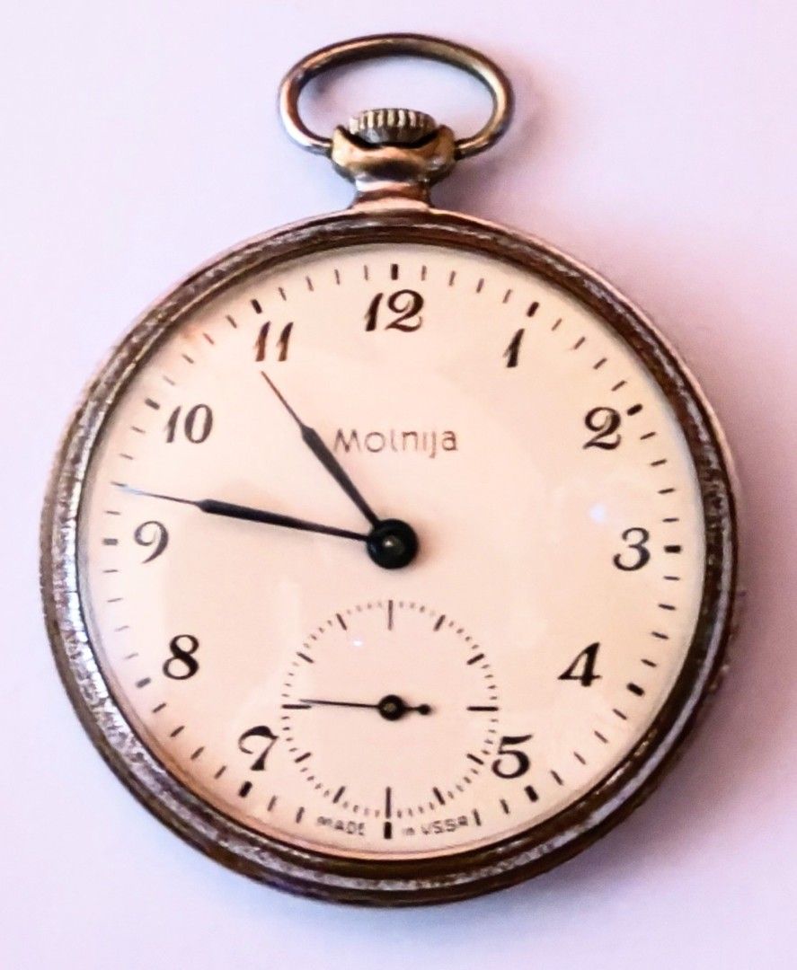 Molnija Pocket Watch Made in USSR (Category: Women's Watches) located in Bocaue. Submitted by zoltanmagy29168 (Listing ID 1451759394, Image 1). Description: - Vintage Molnija pocket watch - Made in the USSR - Cream dial with Arabic numerals - Seconds sub-dial - Striped pattern on the back - Ideal for collectors -Perfectly functional .