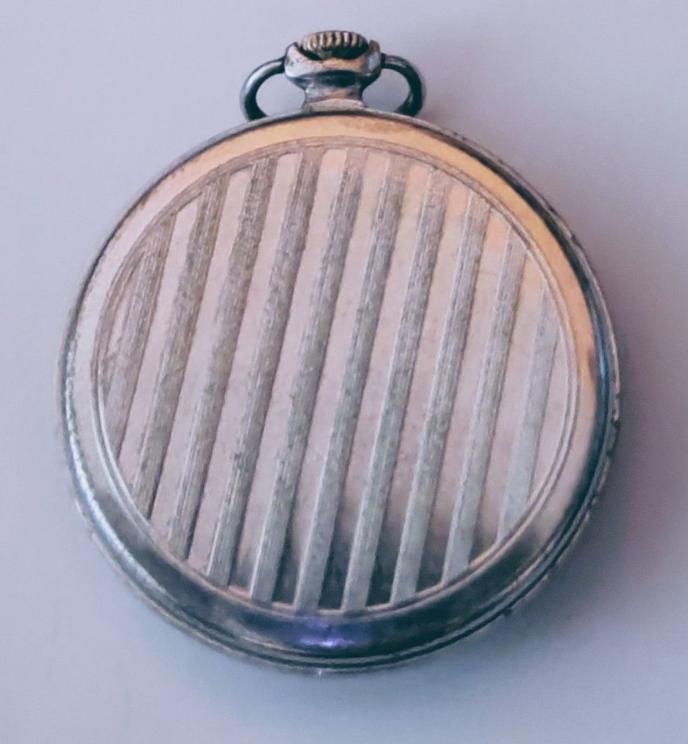 Molnija Pocket Watch Made in USSR (Category: Women's Watches) located in Bocaue. Submitted by zoltanmagy29168 (Listing ID 1451759394, Image 2). Description: - Vintage Molnija pocket watch - Made in the USSR - Cream dial with Arabic numerals - Seconds sub-dial - Striped pattern on the back - Ideal for collectors -Perfectly functional .
