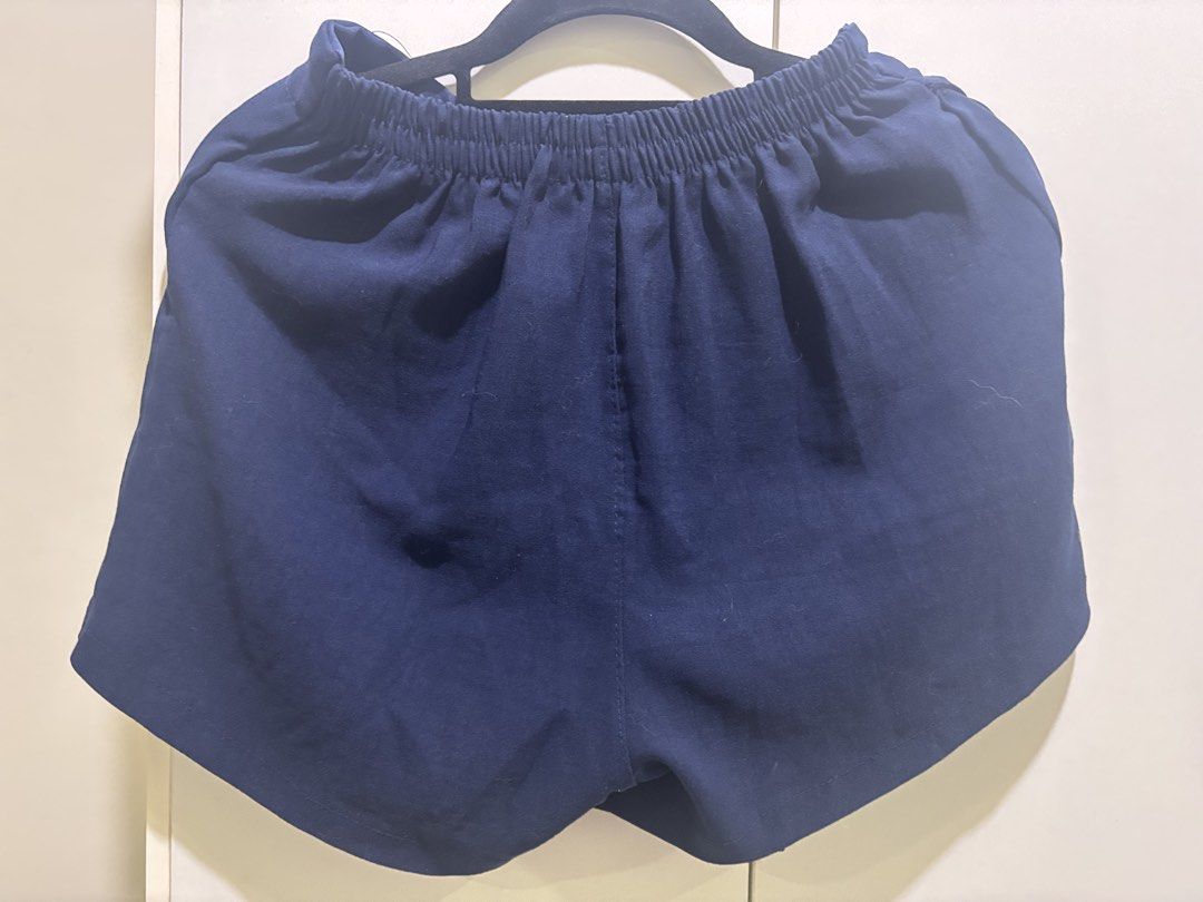 Navy Blue Asymmetrical Skort (Category: Skirts) located in Las Pinas. Submitted by katb86 (Listing ID 1451832135, Image 3). Description: - Navy blue skort - Asymmetrical front design - Comfortable elastic waistband - Skirt appearance with built-in shorts - Ideal for casual or dressed-up looks - Easy to pair with various tops.