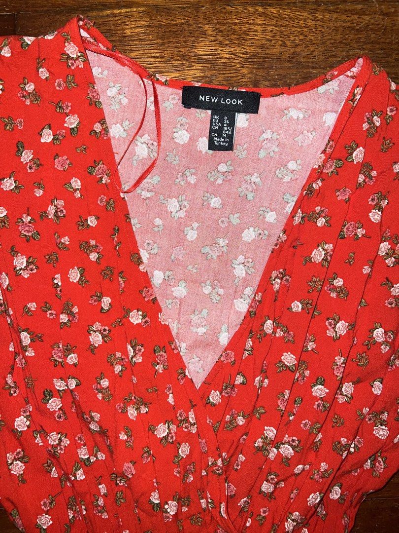 New Look Red Floral Wrap Midi Dress (Category: Dresses) located in Tuguegarao City. Submitted by pauloveditems (Listing ID 1451745565, Image 2). Description: - Red midi dress with a lovely floral print. - Flattering V-neckline and comfortable short sleeves. - Elasticated waist for a perfect, adjustable fit. - Made from a comfortable and flowy material. - Versatile: great for casual outings or dressing up for any occasion..