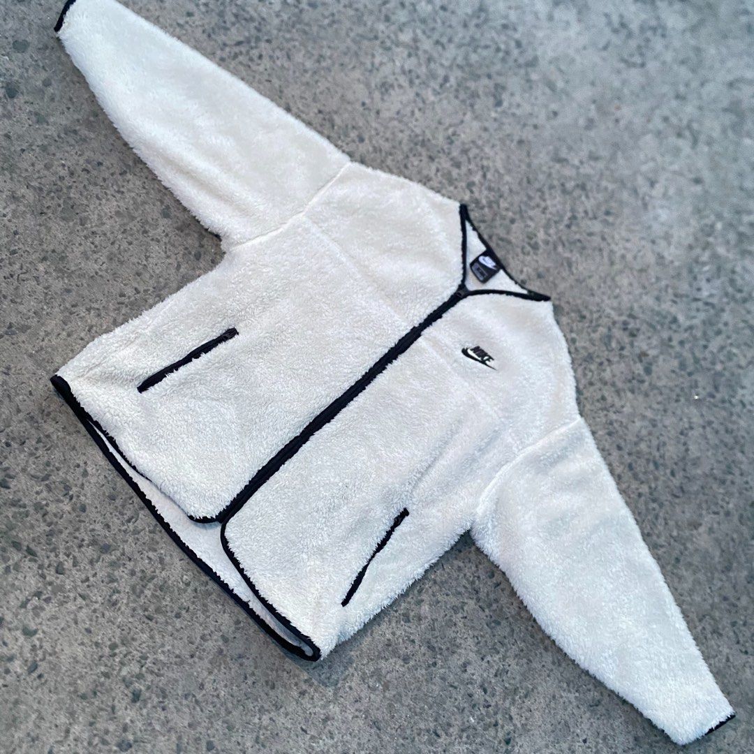 Nike Plush Fleece Zip-Up Jacket Cream Black (Category: Coats, Jackets and Outerwear) located in Manila. Submitted by gius_ich (Listing ID 1451733368, Image 3). Description: - Cream colored Nike fleece jacket - Black trim on collar and zipper - Embroidered Nike logo on chest - Black paneling on the back - Cozy and warm for cooler weather - Ideal for layering.