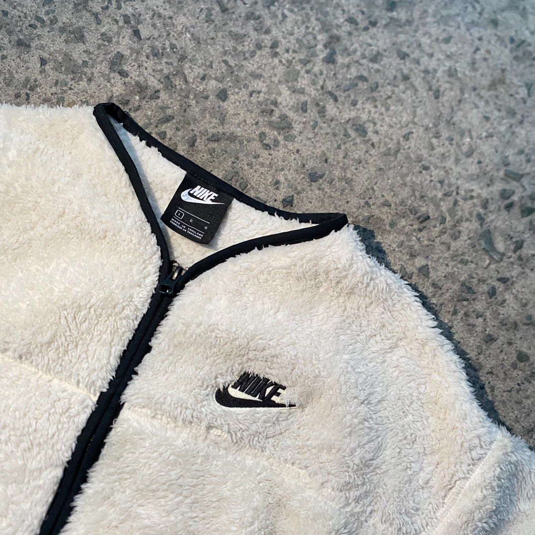 Nike Plush Fleece Zip-Up Jacket Cream Black (Category: Coats, Jackets and Outerwear) located in Manila. Submitted by gius_ich (Listing ID 1451733368, Image 1). Description: - Cream colored Nike fleece jacket - Black trim on collar and zipper - Embroidered Nike logo on chest - Black paneling on the back - Cozy and warm for cooler weather - Ideal for layering.