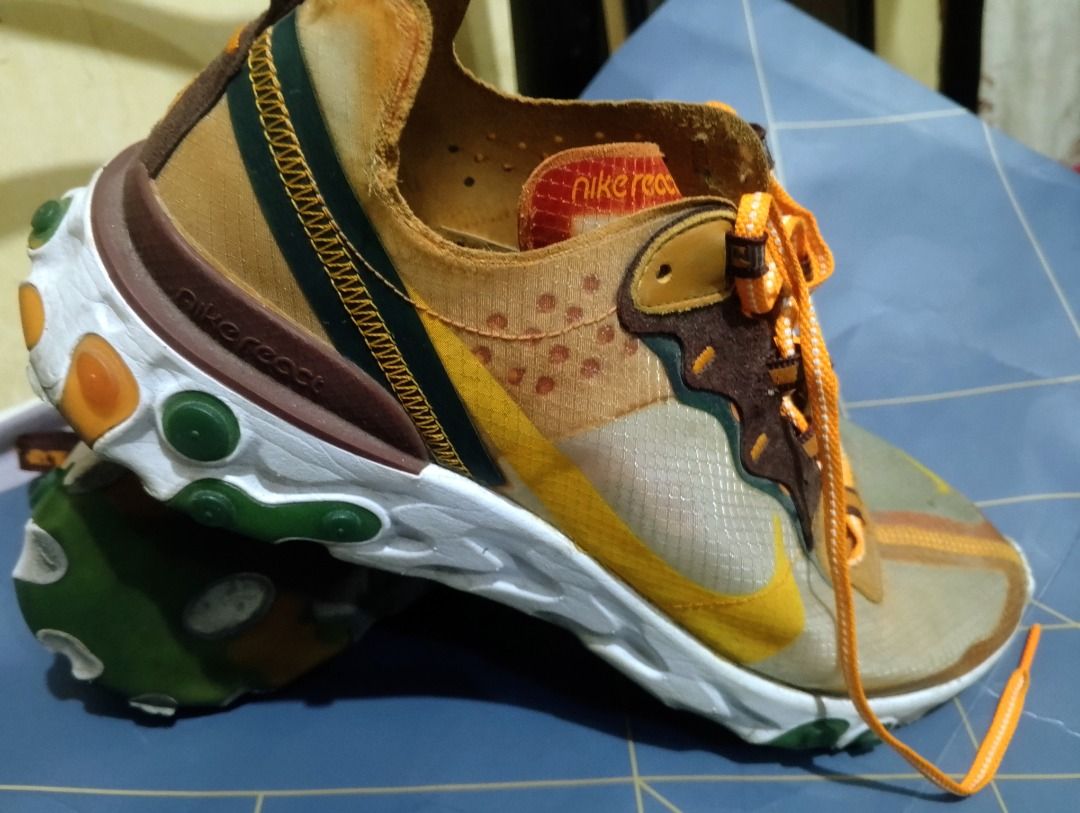 Nike React Element 87 "Moss" Sneakers (Category: Sneakers) located in Caloocan City. Submitted by edsrnava83134 (Listing ID 1451820747, Image 2). Description: - Nike React Element 87 in 'Moss' colorway. - Features a translucent upper. - Accents of brown, yellow, and green. - Unique lacing system. - Comfortable React foam sole. - Perfect for everyday wear and athletic activities. - Distinctive and stylish kicks..