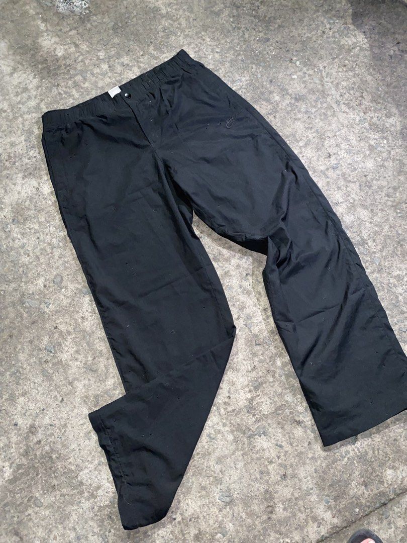 Nike Sportswear Black Track Pants (Category: Joggers) located in Manila. Submitted by gius_ich (Listing ID 1451735625, Image 3). Description: - Black Nike track pants - Size XL - Elastic waistband with drawstring - Side pockets - Back pocket - Small Nike logo on left leg - Made in China - Ideal for sports or casual wear.
