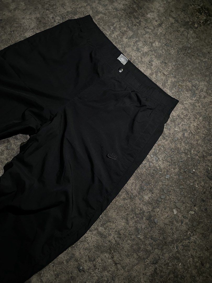 Nike Sportswear Black Track Pants (Category: Joggers) located in Manila. Submitted by gius_ich (Listing ID 1451735625, Image 1). Description: - Black Nike track pants - Size XL - Elastic waistband with drawstring - Side pockets - Back pocket - Small Nike logo on left leg - Made in China - Ideal for sports or casual wear.