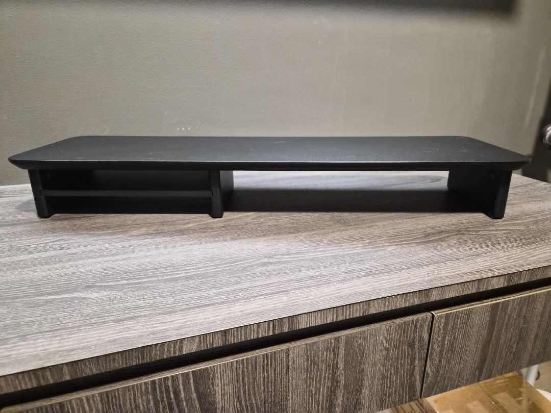 Omnidesk Desk Riser (Category: Tables & Sets) located in Singapore. Submitted by bongaaaaa (Listing ID 1451833421, Image 1). Description: Omnidesk desk riser in black wood, like new condition. Hardly used at all. Dimensions: 80x23x10.5cm RRP $89 .