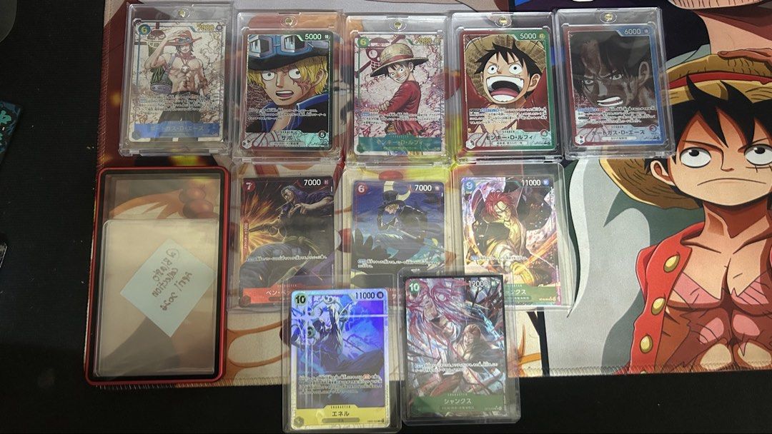 ONE PIECE TCG (Category: Toys & Games) located in Kuala Lumpur. Submitted by blastocollection (Listing ID 1451829013, Image 1). Description: For sale ( BACA CAPTION DULU) Luffy Leader ( WD) - RM 100 Luffy SEC (White Line ) - RMoffer Ace Leader (near mint not psa 10) - RM 75 Ace SEC ( dent ) - RM 75 Sabo Leader (tiny wd) -RM 40 Ben - RM 10 Shanks st16 - RM 10 Shanks op13 - RM 25 Sabo - RM 8 Enel - RM 5 Slab Magnetic Case - RM 25 Self pickup Rawang