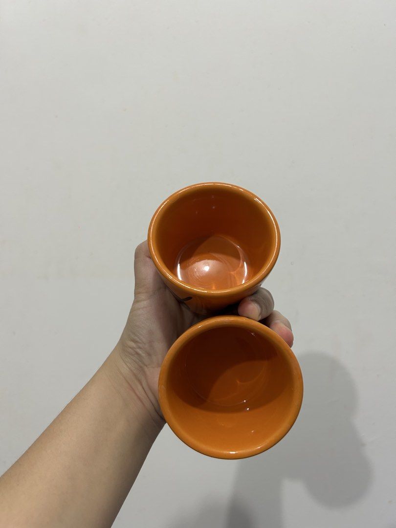 Orange Black Cat Ceramic Cups Set of 2 (Category: Coffee & Tea Tableware) located in Makati City. Submitted by michellecollado07 (Listing ID 1451892282, Image 2). Description: - Set of 2 cute orange cups with black cat design - Perfect for Halloween or cat lovers - Dishwasher, oven, and microwave safe - Ideal for coffee, tea, or small snacks - Made in China.