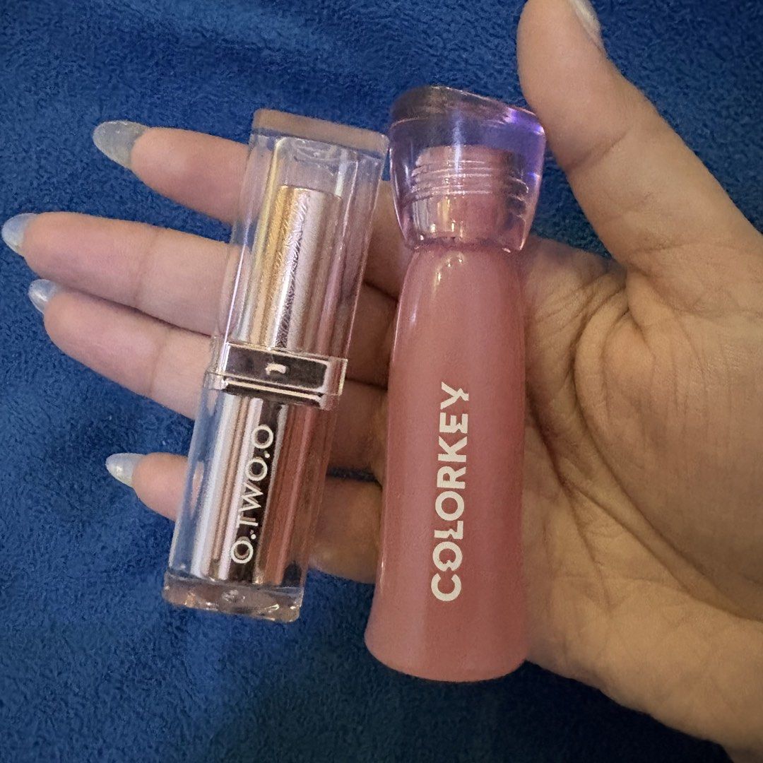 O.TWO.O & COLORKEY Lippie Bundle (Category: Makeup) located in San Juan City. Submitted by mightyyyyy (Listing ID 1451811758, Image 1). Description: - O.TWO.O Glitter Lipstick: Unique, shimmery formula for a dazzling pout. - COLORKEY Soft Matte Water Tint: Shade #P363, a beautiful, long-lasting matte finish. - Both products are full-sized. - Perfect for creating various lip looks and trying new styles. - TRIED ONLY TWICE FOR COLOR SWATCH.