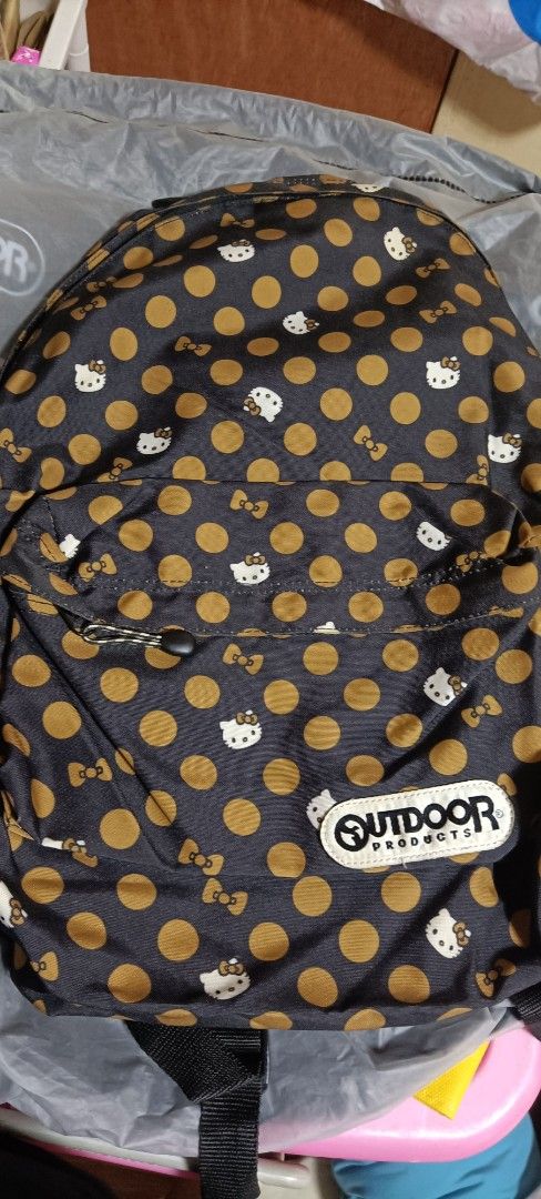 Outdoor Products x Hello Kitty Polka Dot Backpack (Category: Backpacks) located in Bocaue. Submitted by michellesell_2 (Listing ID 1451782086, Image 1). Description: - Cute black backpack - Features gold polka dots and Kitty print - Outdoor Products logo detail - Front zippered pocket for easy access - Plenty of space inside - Ideal for everyday use or travel.
