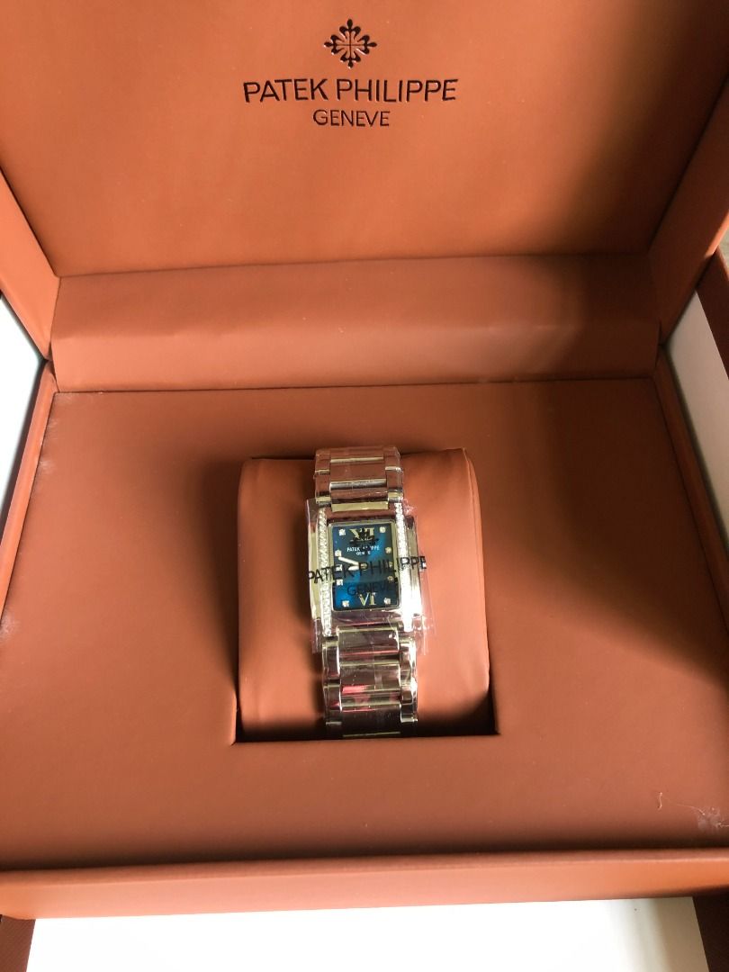 Patek Philippe Geneve Rectangle Watch with Diamonds (Category: Luxury Watches) located in Muntinlupa City. Submitted by esayastale63536 (Listing ID 1451764055, Image 2). Description: - Authentic Patek Philippe Geneve timepiece - Elegant rectangle case with diamond accents - Stunning blue dial with Roman numerals - Comes with original box and papers - A truly beautiful and luxurious watch.