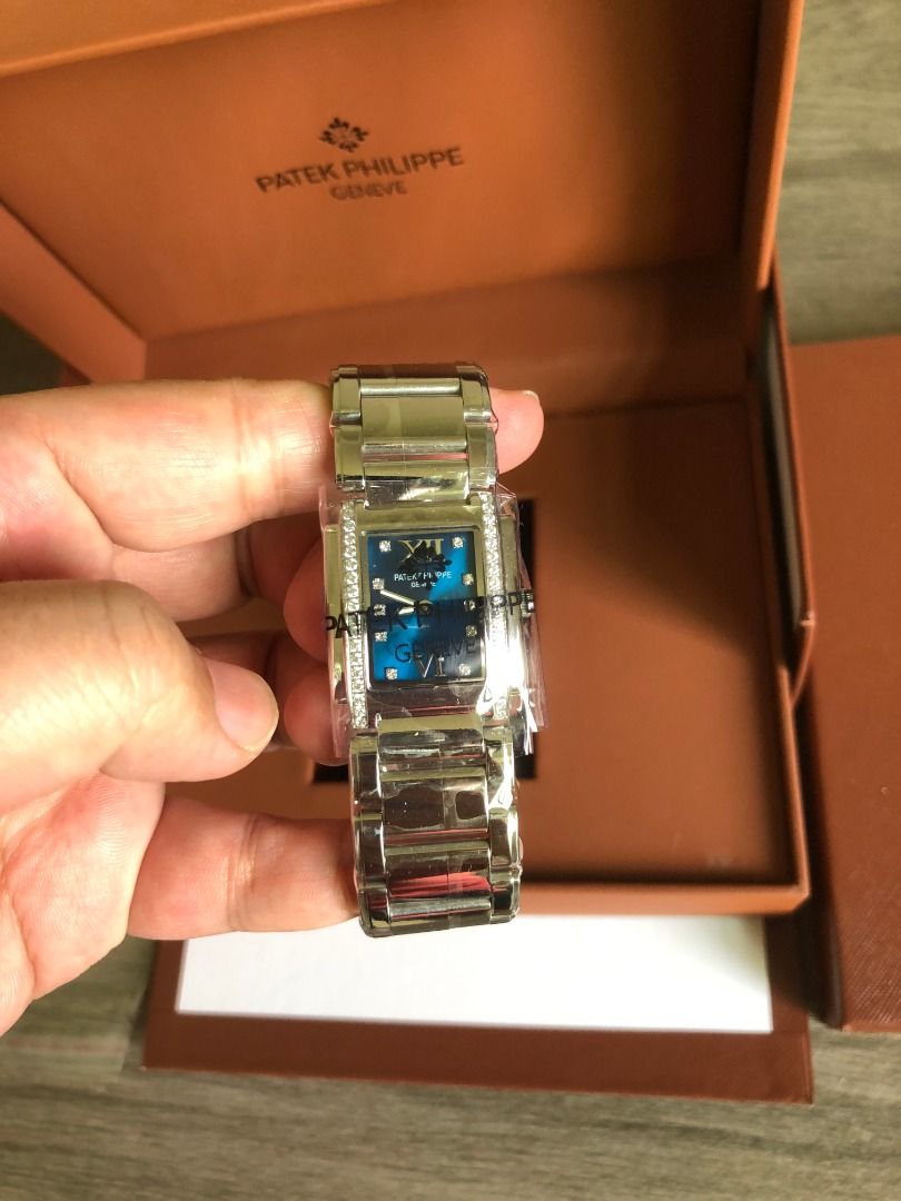 Patek Philippe Geneve Rectangle Watch with Diamonds (Category: Luxury Watches) located in Muntinlupa City. Submitted by esayastale63536 (Listing ID 1451764055, Image 1). Description: - Authentic Patek Philippe Geneve timepiece - Elegant rectangle case with diamond accents - Stunning blue dial with Roman numerals - Comes with original box and papers - A truly beautiful and luxurious watch.