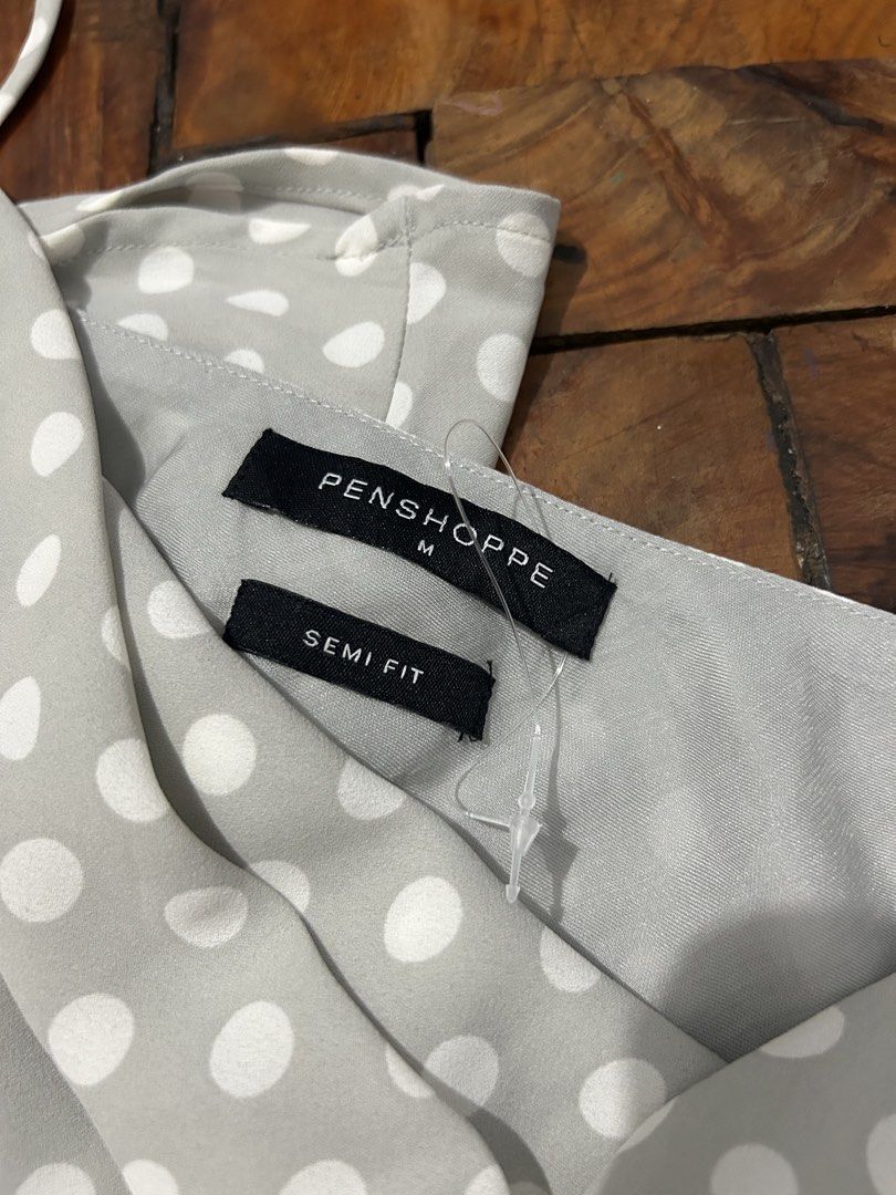Penshoppe Polka Dot Camisole Top Size M (Category: Sleeveless) located in Sorsogon. Submitted by jonacel (Listing ID 1451837295, Image 2). Description: - Grey camisole top - White polka dot pattern - Thin spaghetti straps - Cowl neckline - Semi-fit style - Versatile for layering or standalone wear - Easy to pair with jeans or skirts - Bnew but without tag - just washed and sinukat lang...